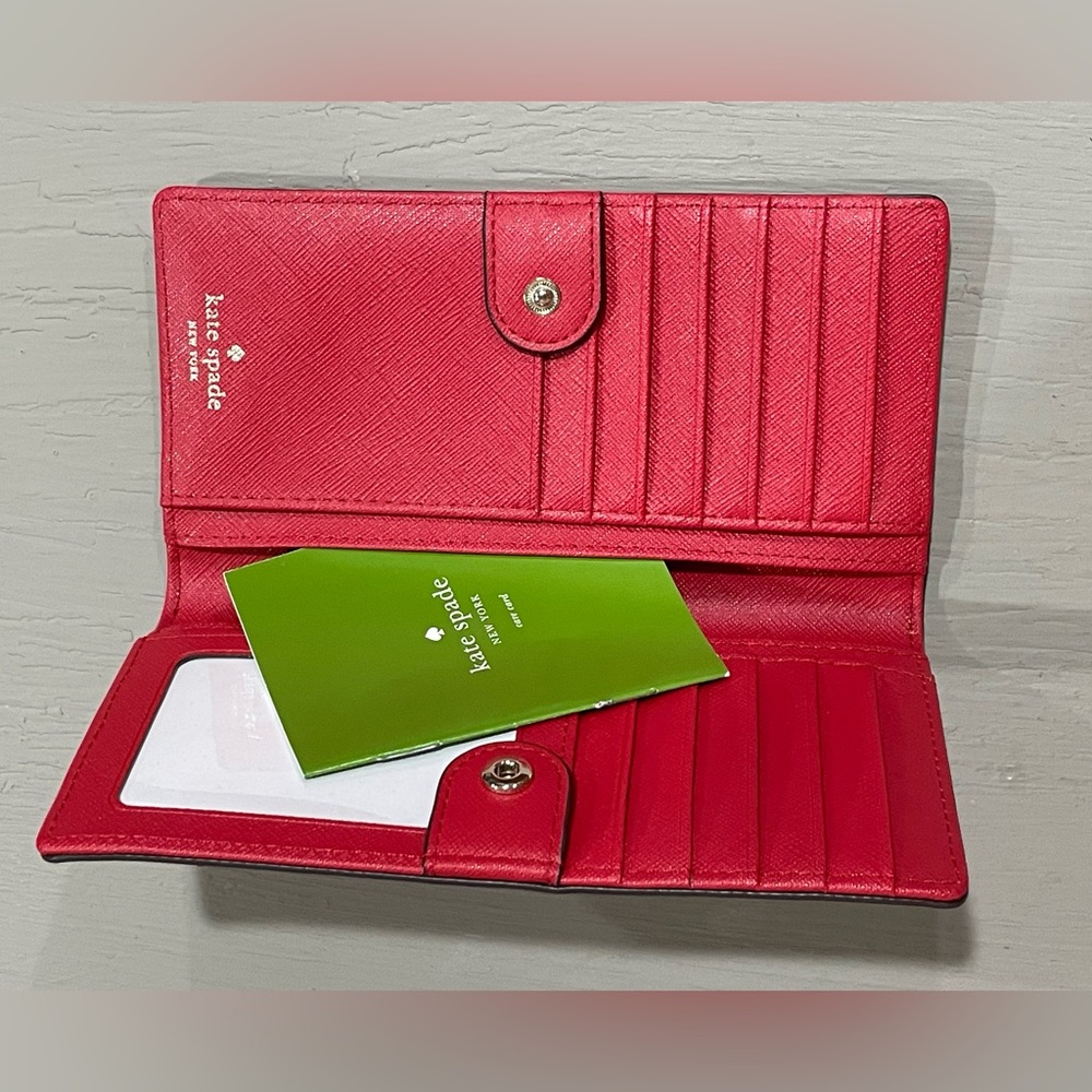 New, never used Kate Spade bifold slim saffiano leather wallet in a bright red
